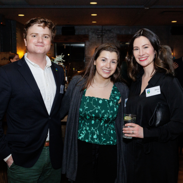 Three UCD alumni at a global event in Chicago.